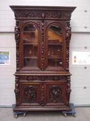 oak figural hunt cabinet/bookcase circa 1860