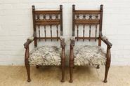 pair of walnut arm chairs 19th century