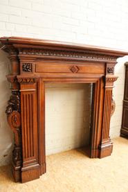 oak fire mantle with lion heads 19th century