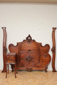 Walnut Louis XV bed and nightstand 19th century