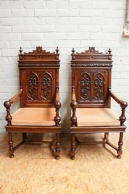 pair of walnut gothic arm chairs 19th century