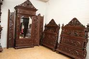 Matching pair of oak hunt beds and single door armoire 19th century