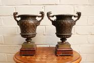 pair of bronze vases with marble base 19th century