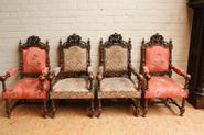 Suite of 4 walnut renaissance arm chairs with cherubs 19th century