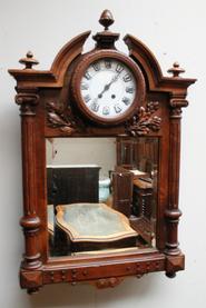 Walnut mirror with clock 19th century