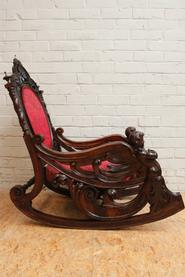 Exceptional walnut cherub rocking chair 19th century