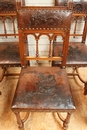 8 walnut Henri II chairs print leather, France 19th century