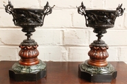 Bronze vases on marble base with hunting scenes