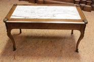 Coffee table with marble top and bronze ornaments