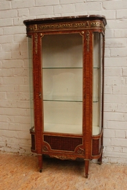 Display cabinet with bronze and marble top