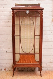 Display cabinet with bronze and wedgewood