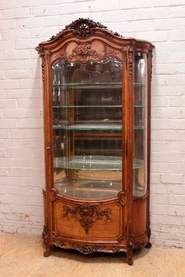 Exceptional bombe Louis XV style display cabinet in oak with beveled glass