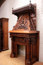 Exceptional gothic style walnut fire mantle