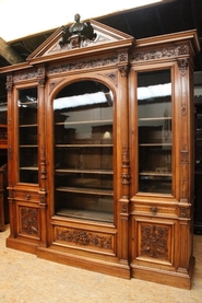 Exceptional monumental walnut renaissance bookcase with bronze statue of Doctor Pinard