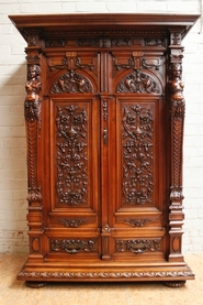 Exceptional quality walnut figural renaissance armoire