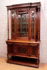 Exceptional renaissance style display cabinet in walnut