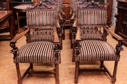Exceptional suite of 8 figural renaissance style arm chairs walnut