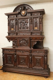 Exceptional walnut figural monumental cabinet with marble inlay