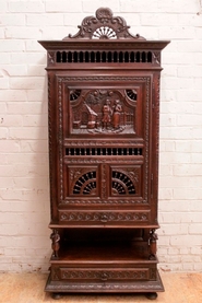 Figural narrow Breton cabinet