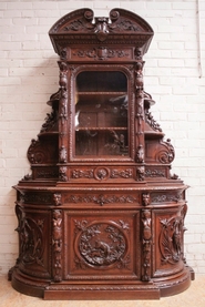 Figural quality hunt cabinet in oak.
