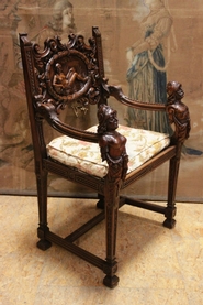 Figural renaissance style arm chair in walnut signed Aimone