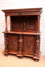 Figural renaissance style cabinet in walnut