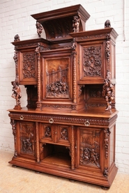 Figural renaissance style cabinet in walnut