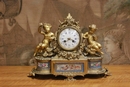 style Clock in gilt bronze, France 19th century