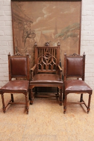 Gothic arm chair and 2 side chairs in walnut and leather