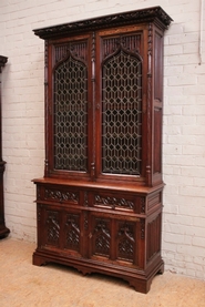 Gothic style bookcase in walnut with stain glass