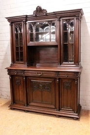 Gothic style cabinet in walnut and beveled glass