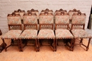 Gothic style 2 arm chairs and 10 chairs in Walnut, France 19th century