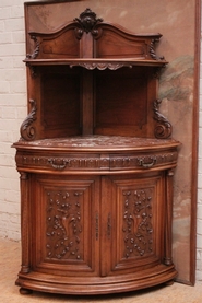 Henri II corner cabinet in walnut