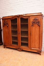Large 4 door marble top Louis XV style bookcase in walnut