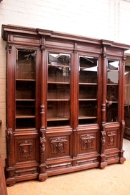 Large 4 door renaissance style bookcase in oak with beveled glass