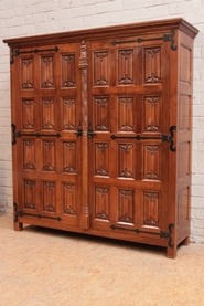 Large gothic style armoire in solid walnut