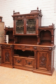 Large renaissance style cabinet in walnut with stain glass