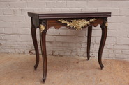Louis XV Game table in palisander and gilt bronze