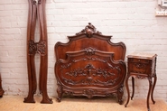 Louis XV style bed and nightstand in walnut