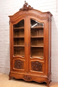 Louis XV style bookcase in walnut with beveled glass