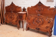 Louis XV styletwin beds and matching end table in walnut