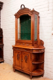 Louis XVI bombe display cabinet in walnut with beveled glass