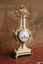 Louis XVI style Clock in mahogany & gilt bronze, France 19th century