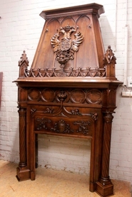 Monumental castle fire mantle in gothic style walnut