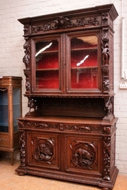 Monumental figural hunt style cabinet in oak