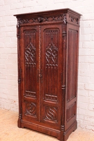 Narrow 2 door armoire gothic style in oak