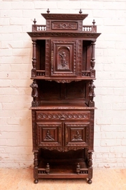 narrow breton figural cabinet