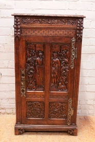 Narrow gothic medieval style cabinet in oak