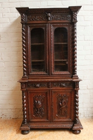 Oak hunt cabinet with carved sides