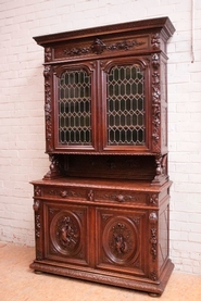 Oak hunt cabinet with stain glass